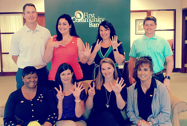 First Community Bank employees celebrating the banks 25th anniversary. 
